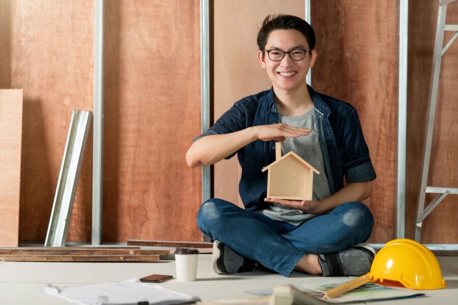 asian-attractive-glasses-interior-designer-working-house-site-renovation-construction-progress-with-smile-confident-desk-with-blue-print-drawing-tool (1)